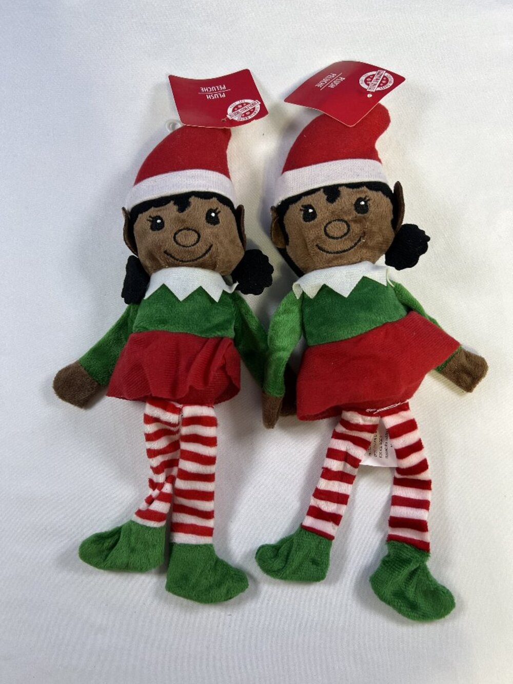 Two Christmas House brand plush girl elf dolls.